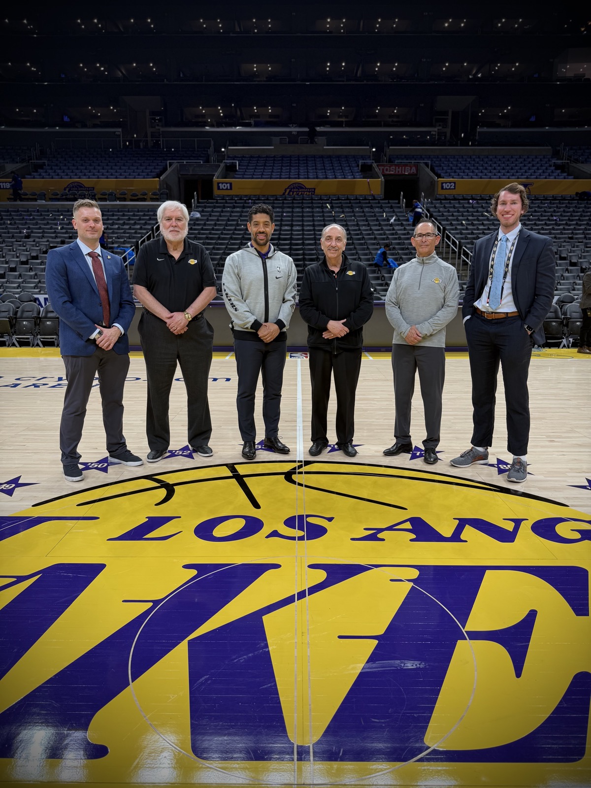 Dr. Swisher with Lakers medical staff at center court